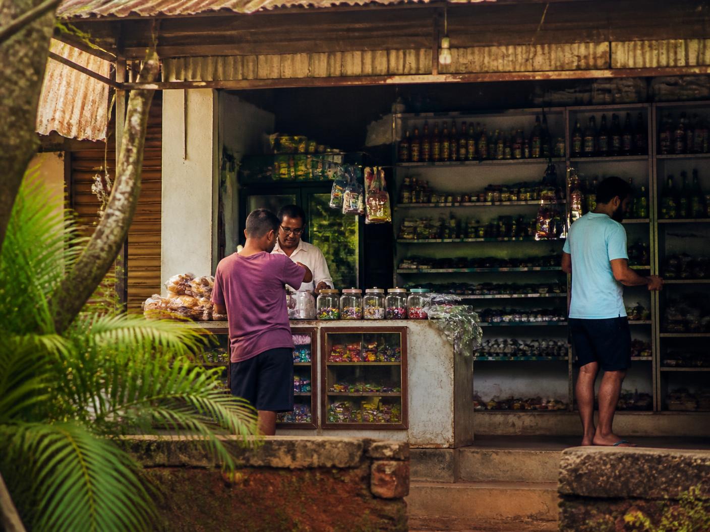 People gathering at a family-run shop in North Goa